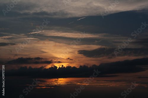 sunset - view of cloudy sky and setting sun