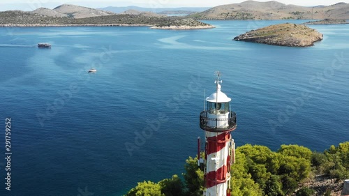 Aerial drone shot of a coastal lighthouse in Croatia, Europe photo