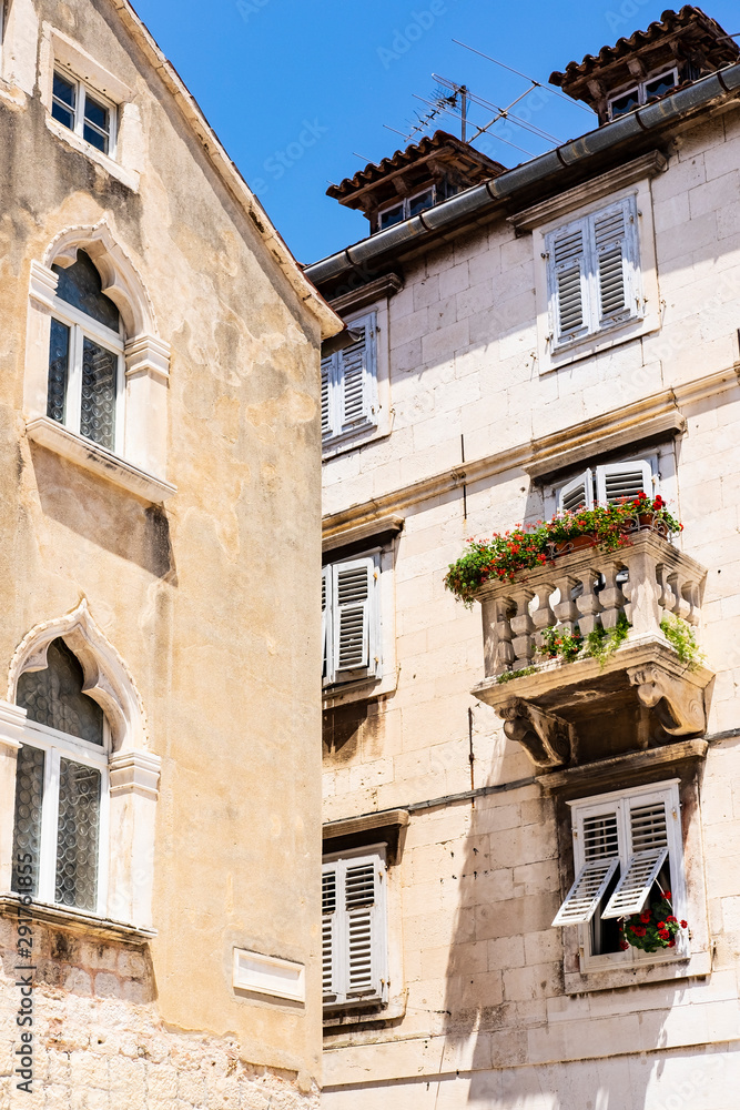 Stone house and balcony in the street of old town, on summer day, Split, Dalmatia, Croatia 