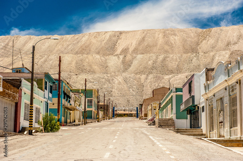 Chacabuco Ghost Town from the Saltpeter Mining Era near Chuquicamata, world`s biggest open pit copper mine, Calama, Chile. Mining Operations at open pit Copper Mine near Calama, Northern Chile. photo