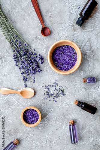 Fototapeta Naklejka Na Ścianę i Meble -  Essential oil and lavender salt with flowers top view