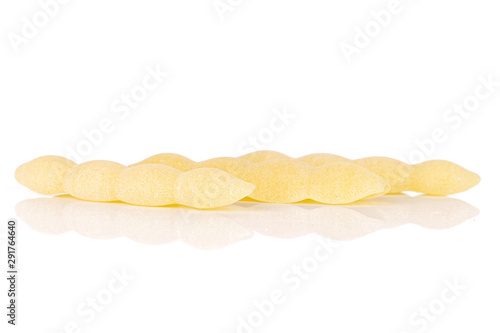 Group of three whole uncooked pasta cavatelli in row isolated on white background photo