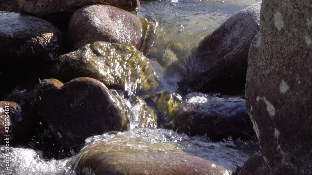 A small stream flows down the stones A small stream flows down the stones