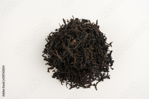 Many different types of black tea on a white background