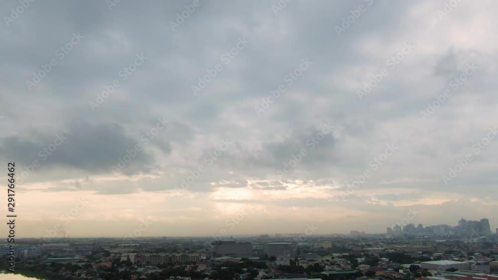 Serene nice view of massive cloudy sky over the silhouette buildings before it rain Serene nice view of massive cloudy sky over the silhouette buildings before it rain