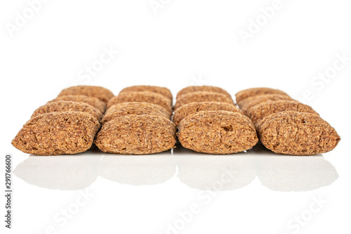 Lot of whole crispy brown cereal pillow isolated on white background