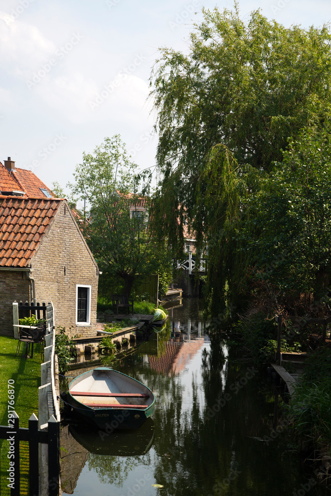 View along small canal in historic Dutch city Hindeloopen