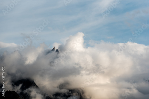 Fotografía Aiguille du Midi top station emerging from low clouds