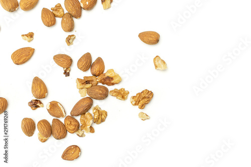 Lot of whole brown almond nut flatlay on white background