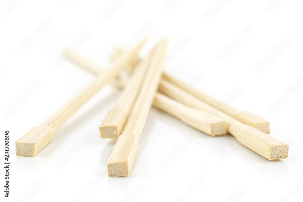 Group of six whole crossed asian brown chopsticks isolated on white background Group of six whole crossed asian brown chopsticks isolated on white background