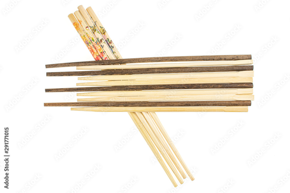 Lot of whole asian brown chopsticks flatlay isolated on white background