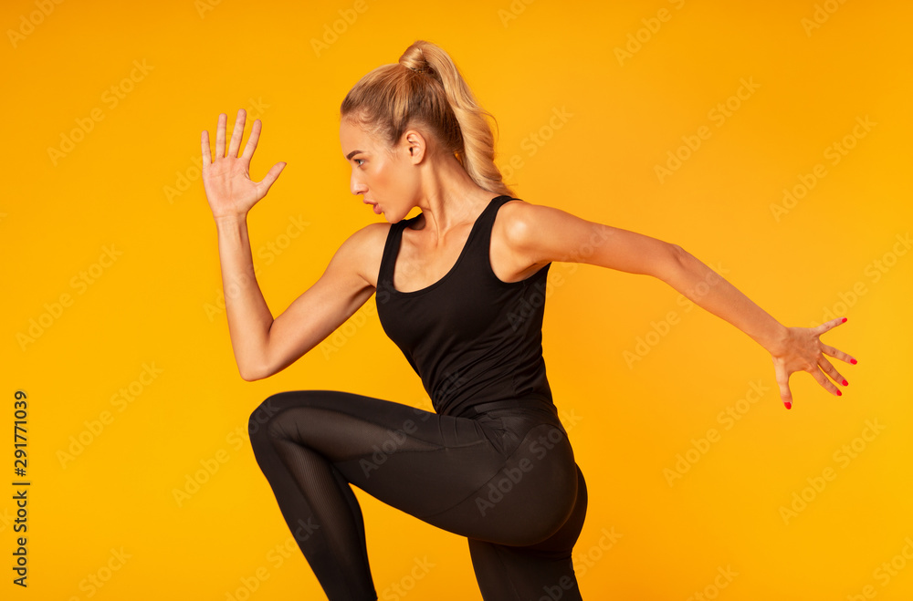 Fitness Girl Jumping Working Out Over Yellow Background - obrazy, fototapety, plakaty 