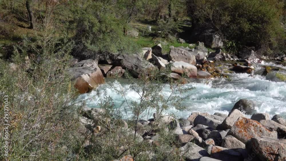 Mountain river flows high in the mountains Mountain river flows high in the mountains