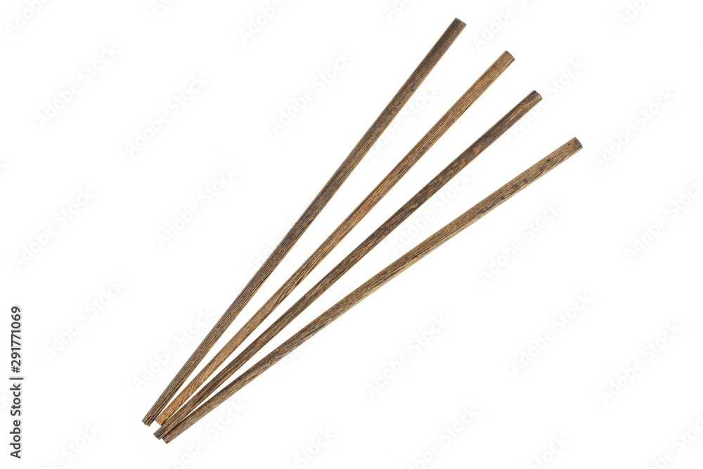 Group of four whole asian brown chopsticks flatlay isolated on white background