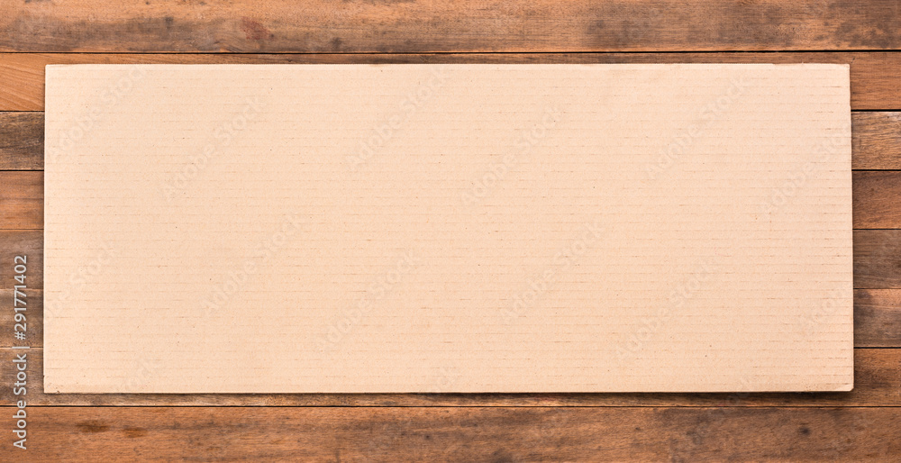 blank corrugated paper on grunge wooden table blank corrugated paper on grunge wooden table