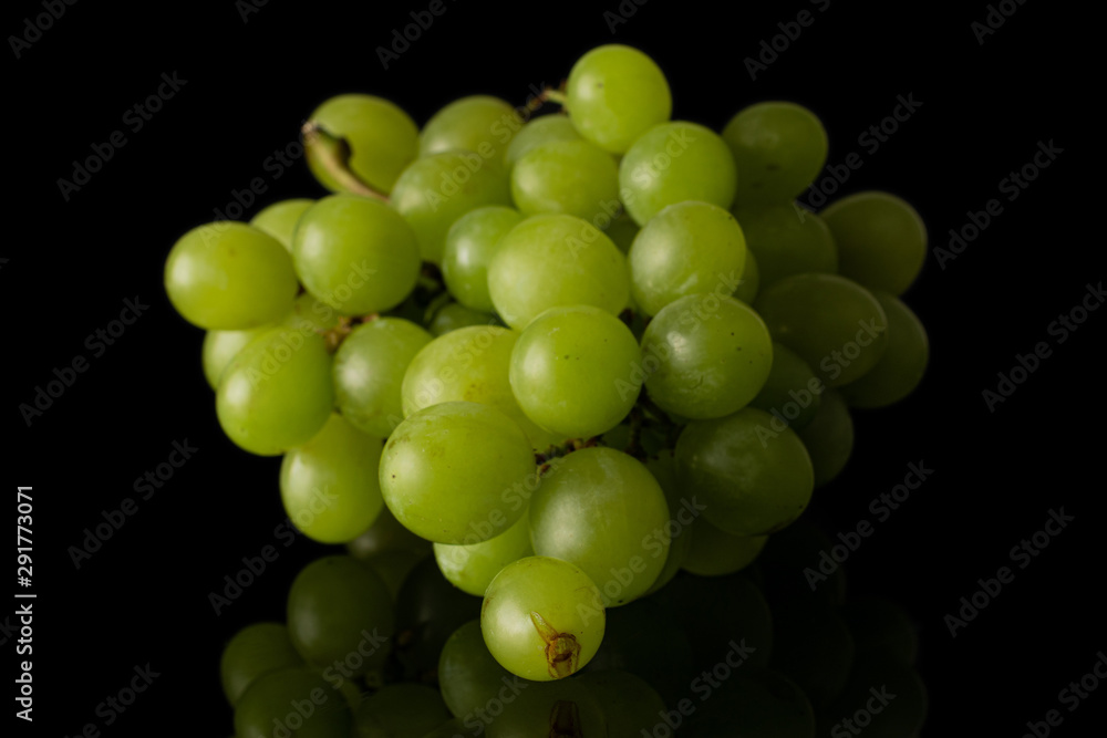 Lot of whole fresh green grape isolated on black glass Lot of whole fresh green grape isolated on black glass