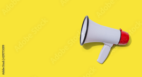 White megaphone with hard shadow overhead view