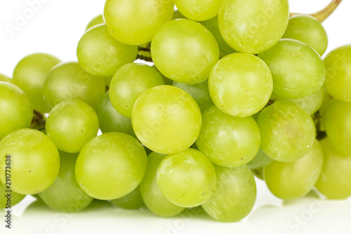 Lot of whole fresh green grape cluster closeup isolated on white background