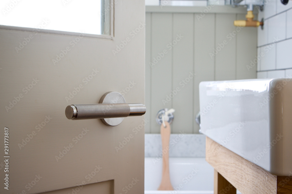stainless steel door handle on a luxury bathroom door Stock Photo ...