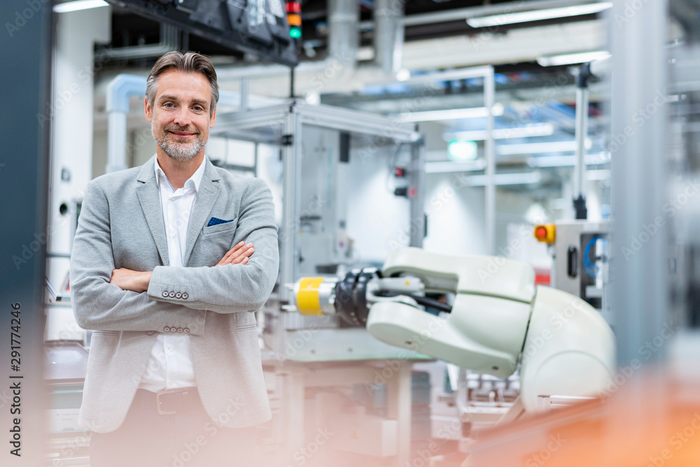 Portrait of a confident businessman in a modern factory Portrait of a confident businessman in a modern factory