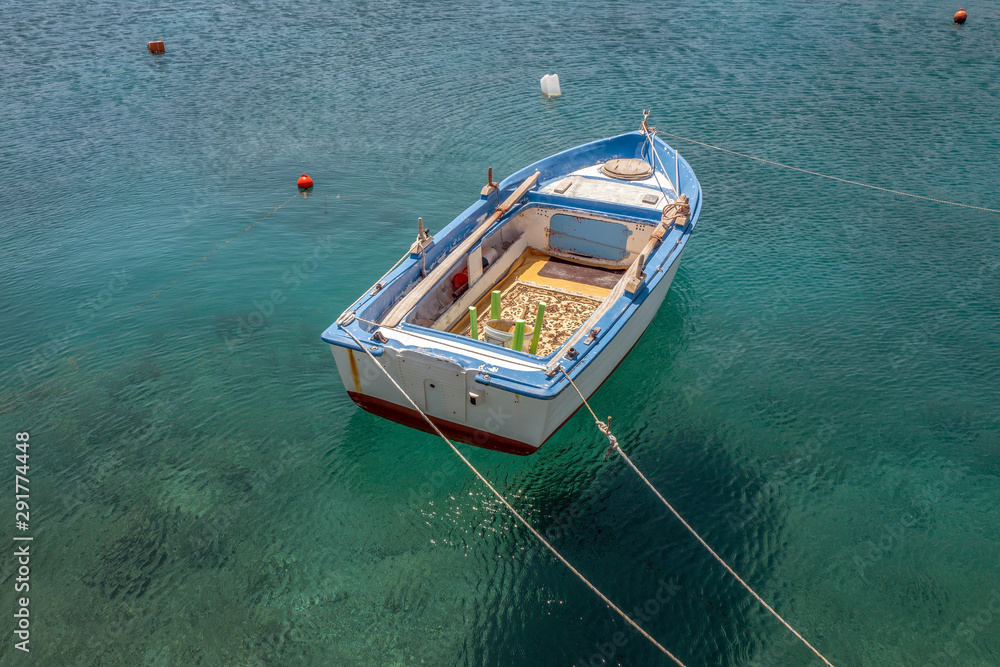 Moored boat in the port of Kokkari in Samos, Greece. Moored boat in the port of Kokkari in Samos, Greece.