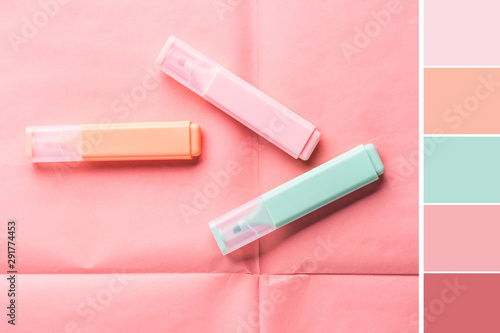 Bild auf Leinwand Pastel color markers on coral pink geometrical background