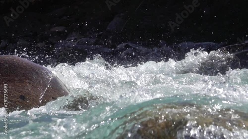 Wallpaper Mural Spray on the stones of a mountain river in slow motion Torontodigital.ca