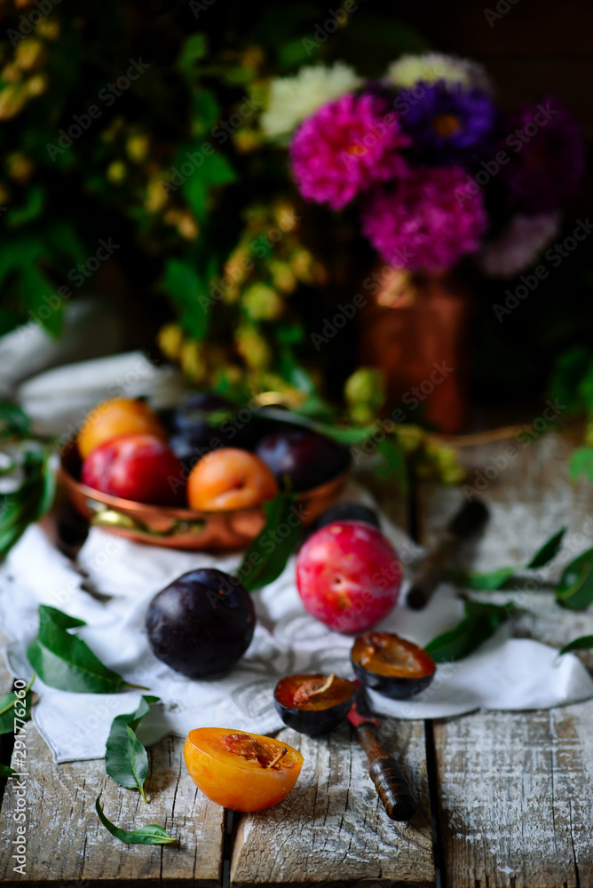 Autumn still life with plums .style rustic Autumn still life with plums .style rustic