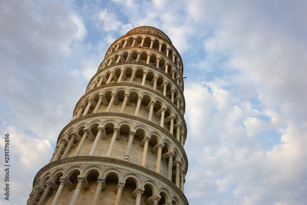 Leaning Tower of Pisa, Italy, with a cloudy sky. The most famous landmark of Italy