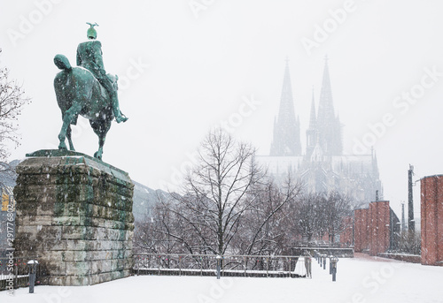 Kaiser Wilhelm II statue against Cologne Cathedral during winter in city photo