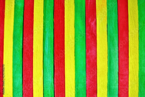 Old vintage with heart wood background.Reggae background.Green,red and yellow on oak wood.green, yellow, red color on crack wood. 