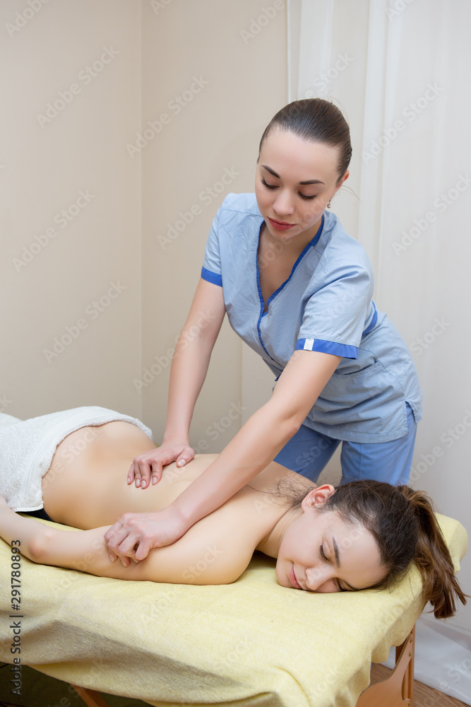 Hot Massuese Sexy masseuse massages a woman foto de Stock | Adobe Stock