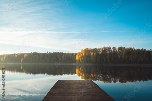 Fototapeta Naklejka Na Ścianę i Meble -  Autumn lake landscape. Wooden bridge.