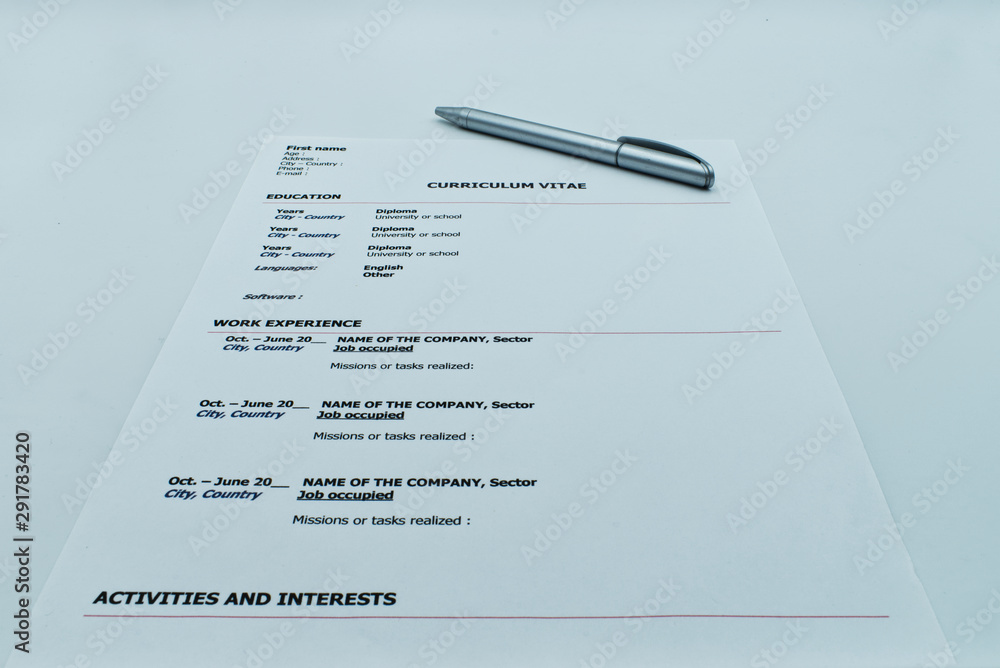 Obraz premium Resume, Curriculum Vitae, ready to be filled out with a pen, on white background
