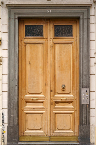 Old elegant wooden double door in Nice, France
