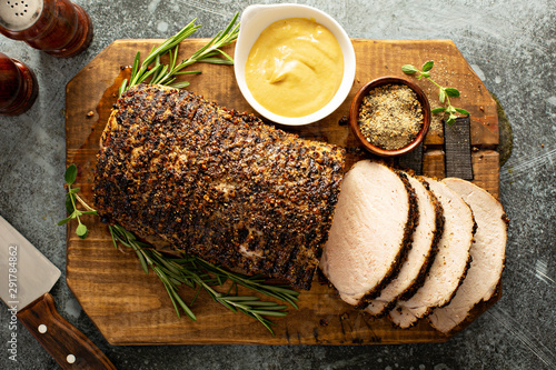 Roasted pork loin with a spicy rub and mustard sauce photo