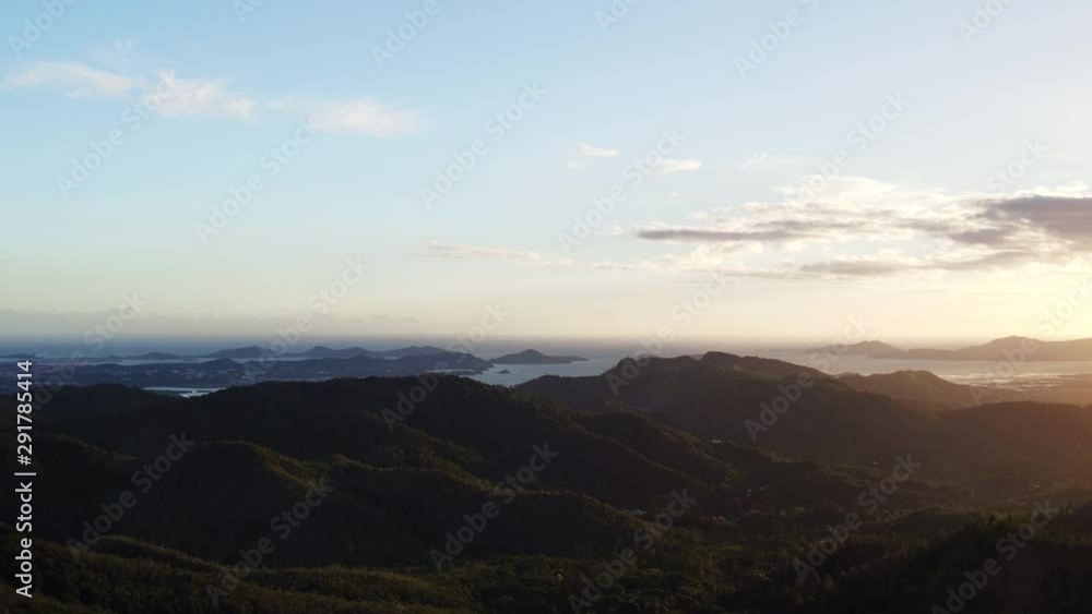 Wide aerial, sunset over coastal mountains in Australia Wide aerial, sunset over coastal mountains in Australia