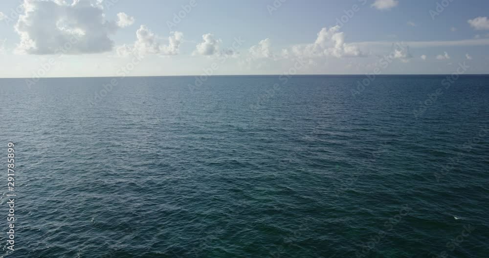 Wide aerial, ocean horizon in slow motion Wide aerial, ocean horizon in slow motion