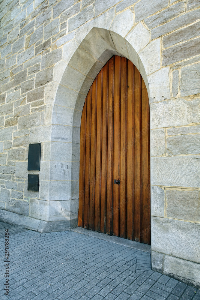 Old Medieval Wooden Door Surrounded by Stone Walls