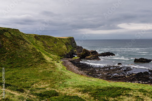 Ireland - coast view, green landscape, rough coasts, cliffs, monastery, graveyards and cloisters