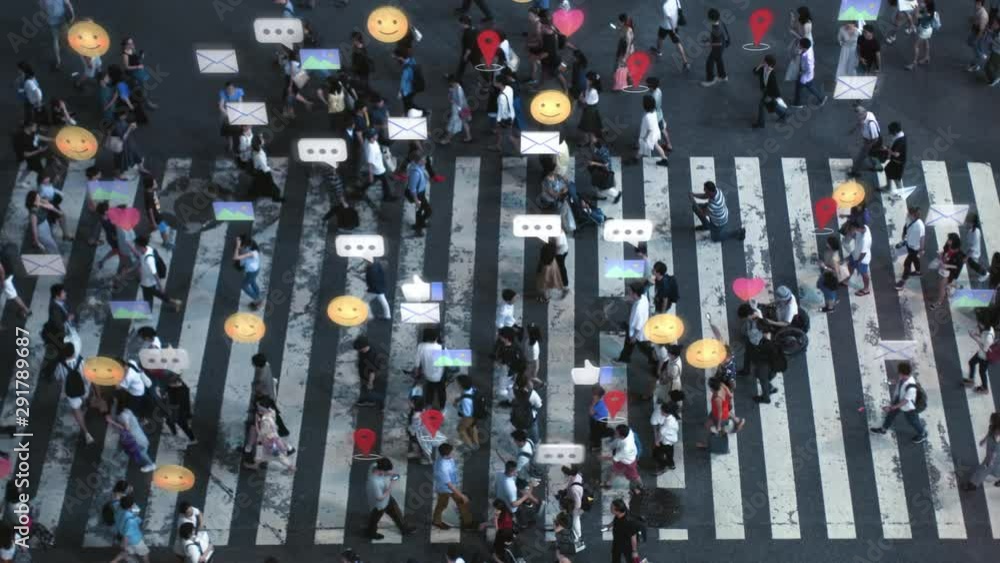 High Angle Shot of a Crowded Pedestrian Crossing in Big City. Augmented Reality of Social Media Signs, Symbols, Location Tracking and Emojis are Added to People. Future Technology Concept.