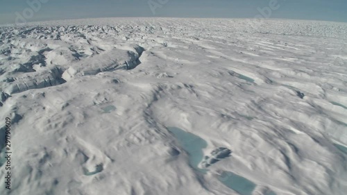 Flying over Greenland tundra, helicopter point of view