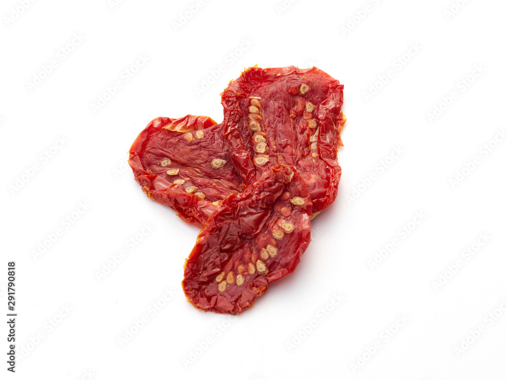 Sun Dried tomatoes in the sunshine on white Sun Dried tomatoes in the sunshine on white