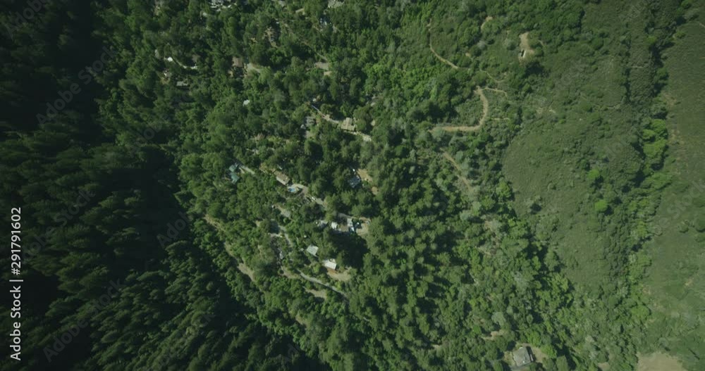 Birds eye view aerial shot above greenery and mountain range, day Birds eye view aerial shot above greenery and mountain range, day