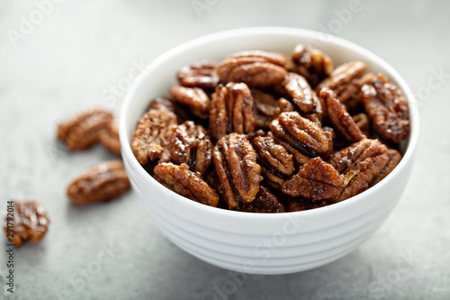 Caramelized or candied pecans for appetizer or salad in white bowl