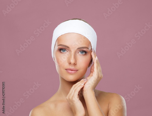 Beauty portrait of healthy and attractive woman. Human face in a concept of spa, skin care, cosmetics, make-up, complexion and face lifting.