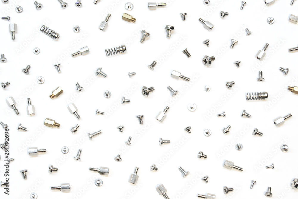 Mix of bolts, screws and pins on white background.