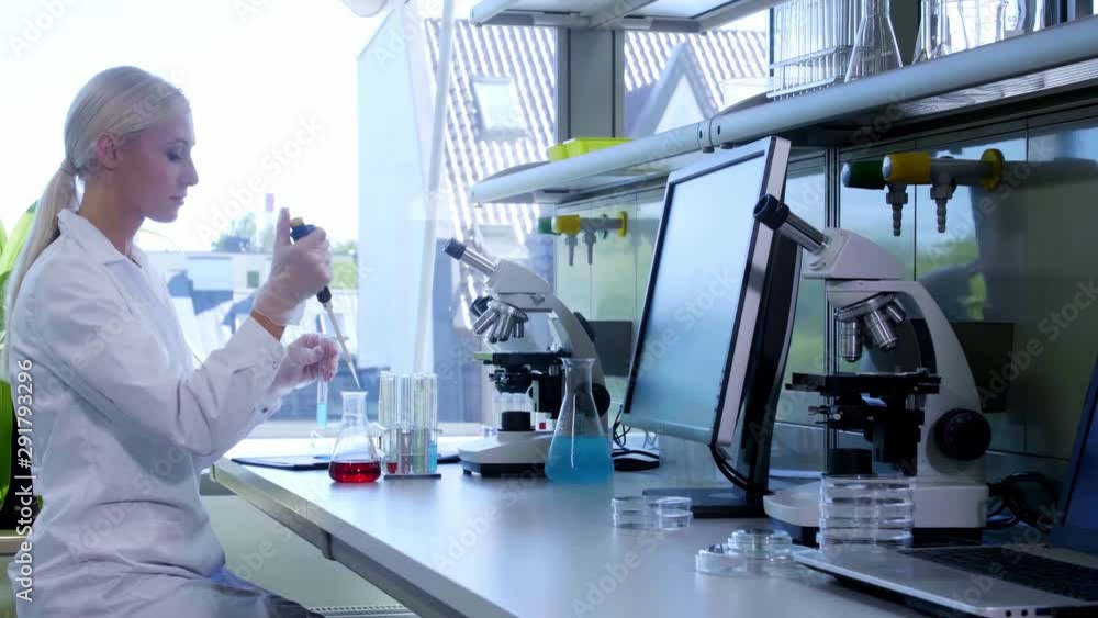 Female scientist working in modern lab. Doctor making microbiology research. Biotechnology, chemistry, bacteriology, virology, dna and health care concept. Female scientist working in modern lab. Doctor making microbiology research. Biotechnology, chemistry, bacteriology, virology, dna and health care concept.