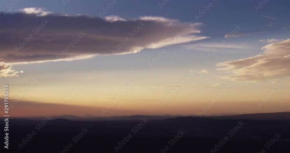 Helicopter aerial shot of cloudy sunset over mountains Helicopter aerial shot of cloudy sunset over mountains