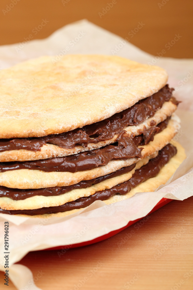 Stacking cake layers. Making Hungarian Cake. Stacking cake layers. Making Hungarian Cake.
